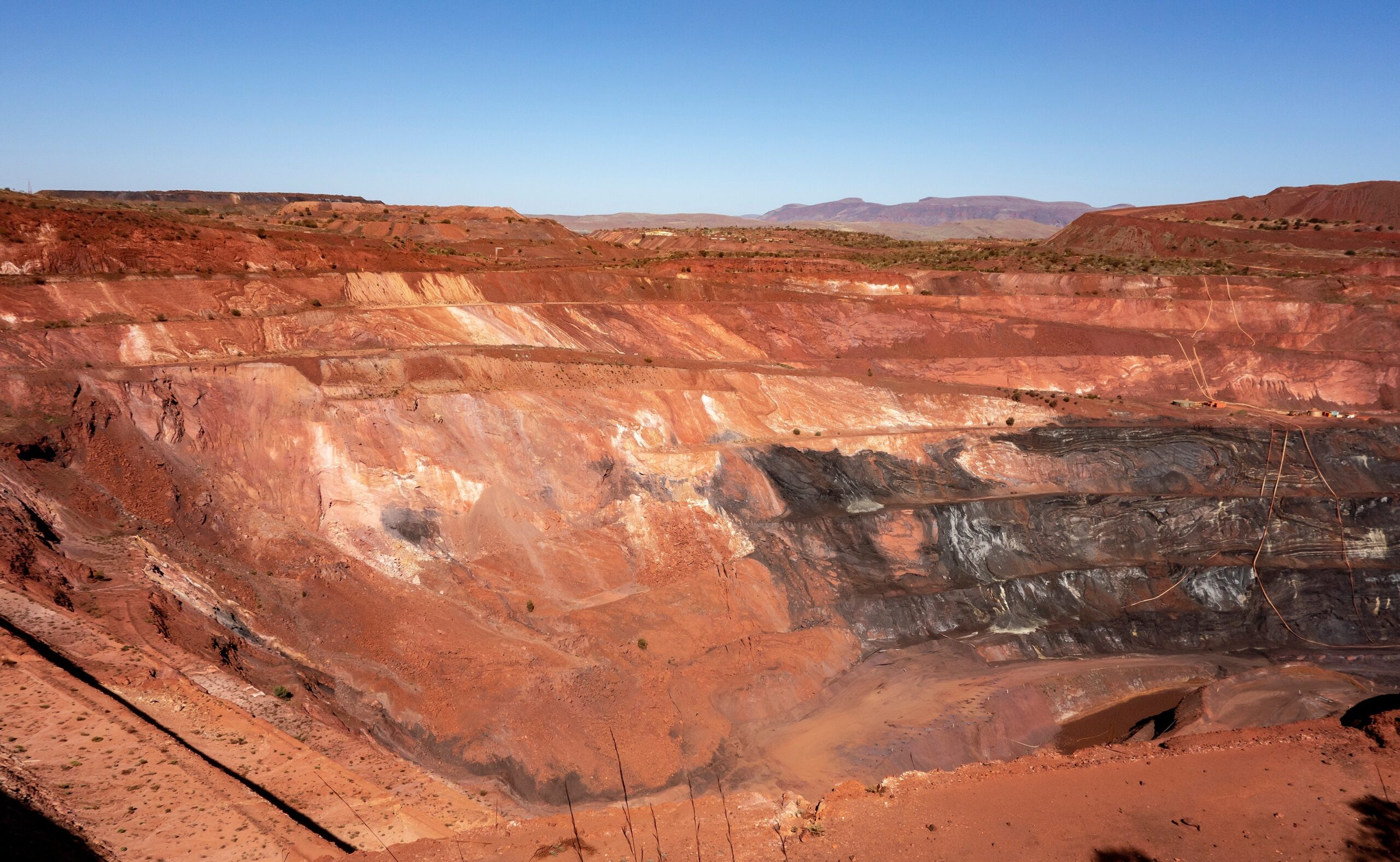 Deep pit of red iron ore mine