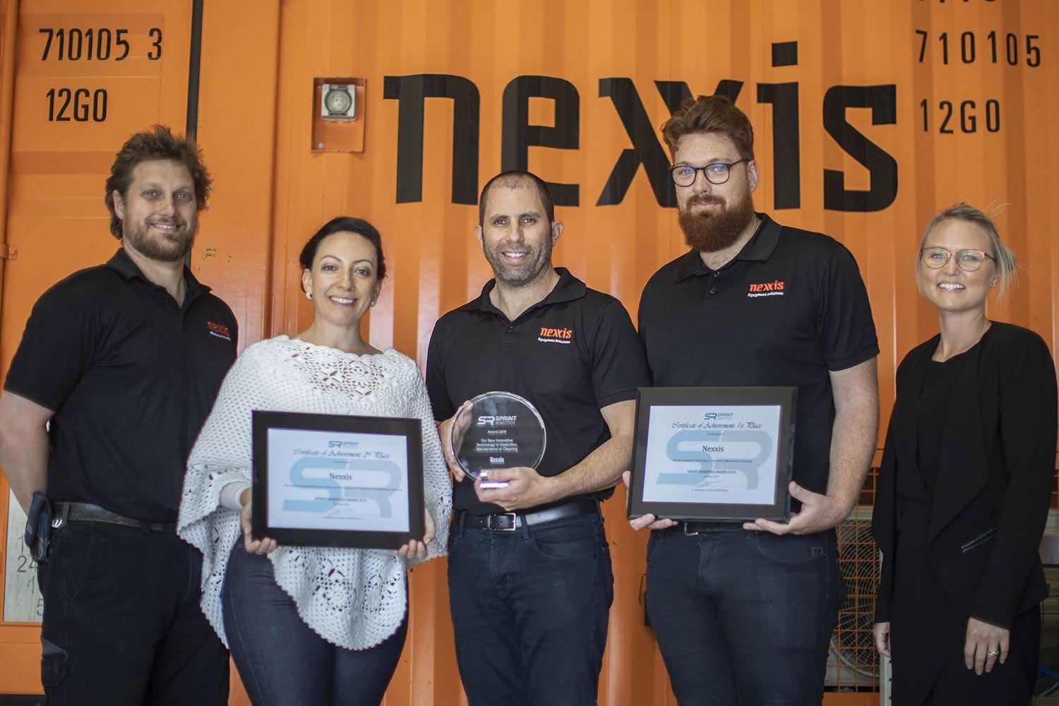 Nexxis staff team receiving awards for innovation